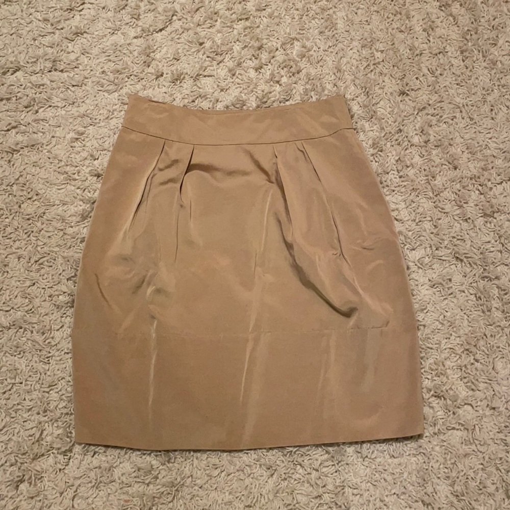 A-line gold skirt with pockets.